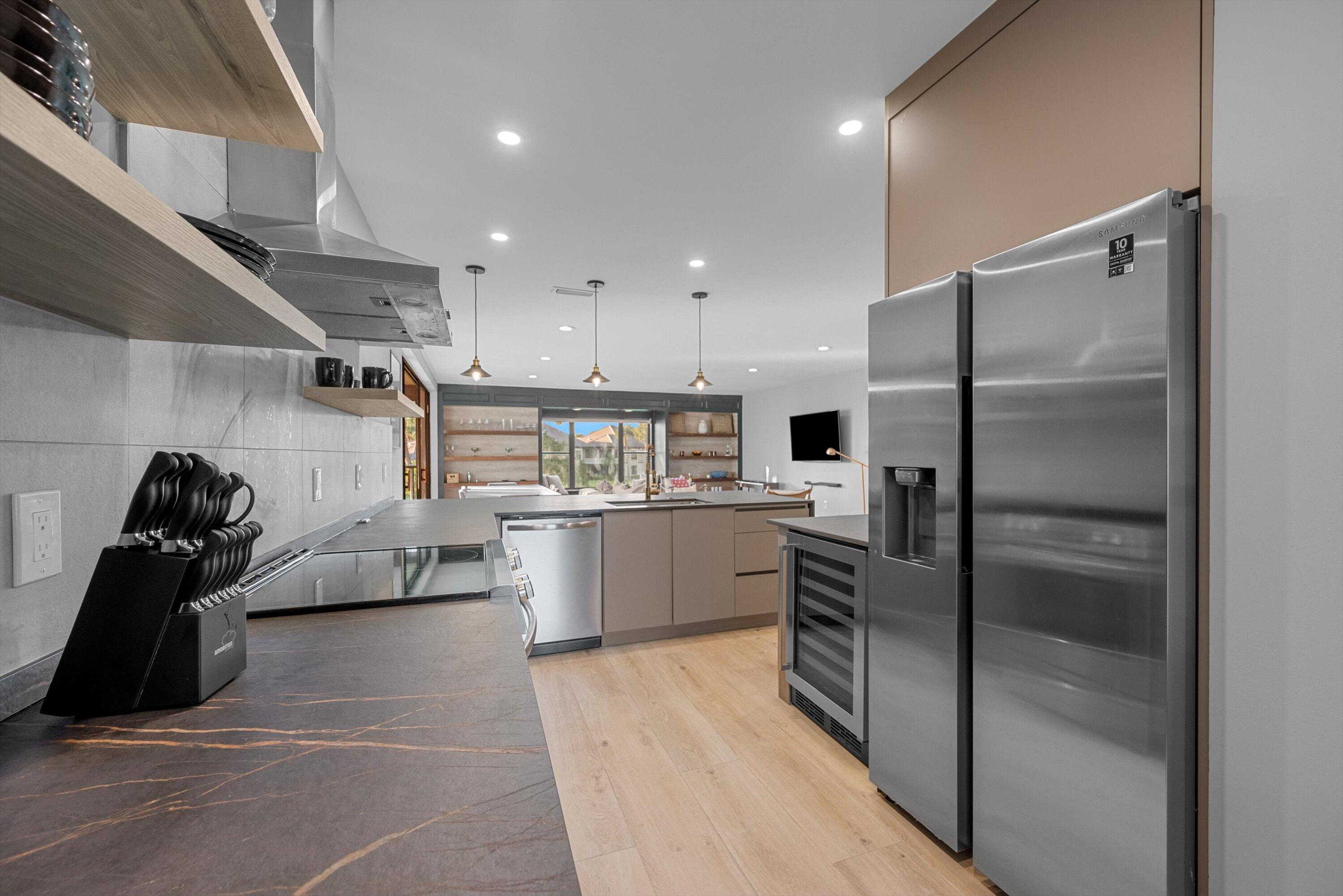 13224 Polo Club Road, Unit A204 Wellington, FL 33414 - Photo 10 of 27 a kitchen with a refrigerator and a sink