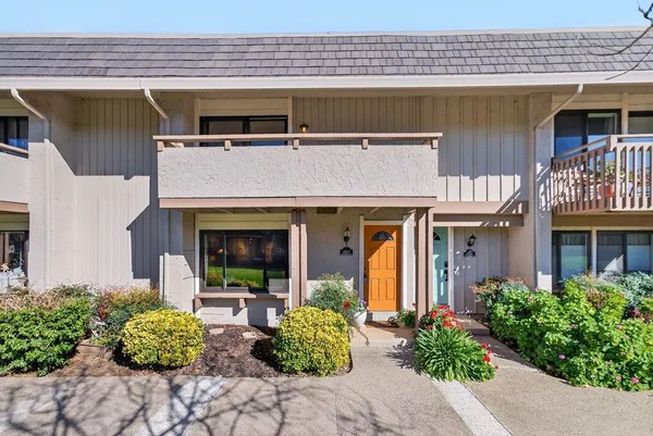 a front view of a house with garden