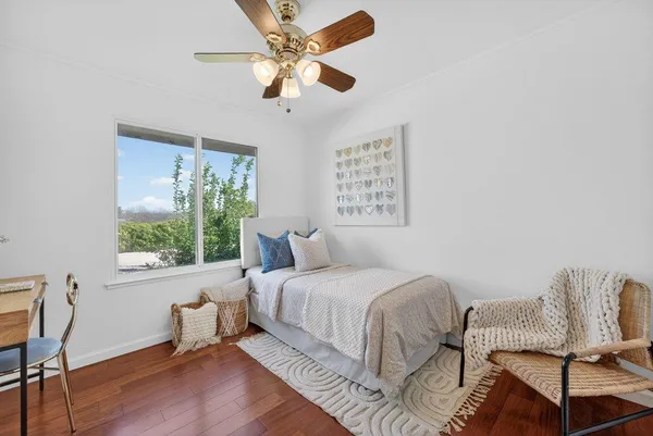 a bedroom with a bed and a chair