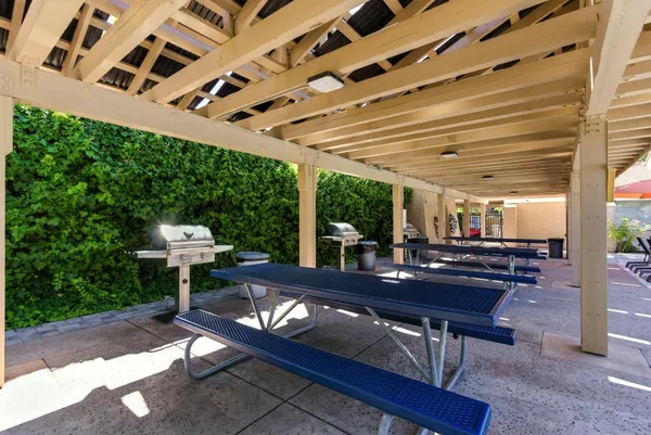 a living room with a table and chairs