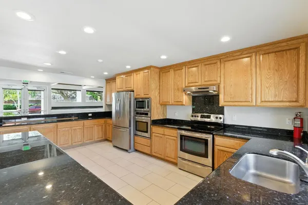 a view of a dining area with furniture window and wooden floor