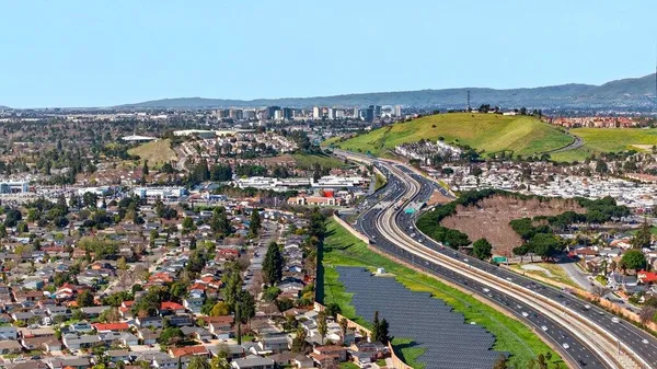 an aerial view of residential houses with outdoor space