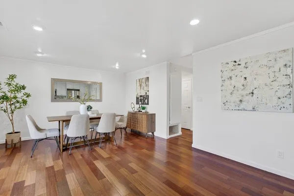 a view of a livingroom with furniture and a workspace