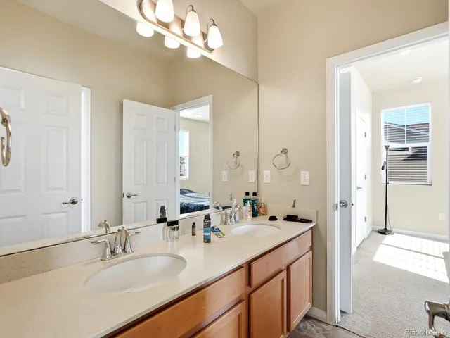 a bathroom with a sink double vanity and a mirror