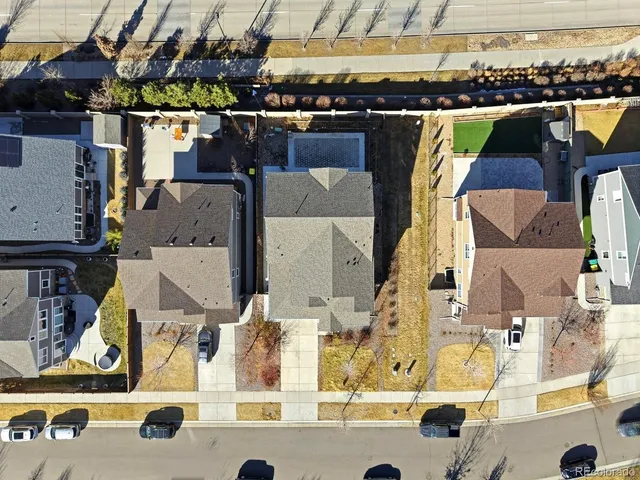 an aerial view of residential houses with outdoor space