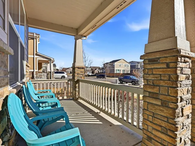 a view of a balcony with chairs