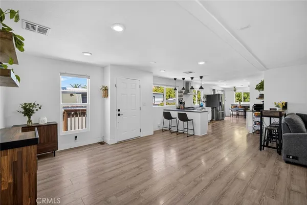 a view of kitchen with furniture and wooden floor