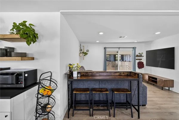 a dining room with furniture window wooden floor