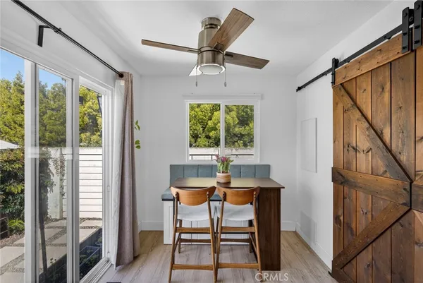 a workspace room with furniture and windows
