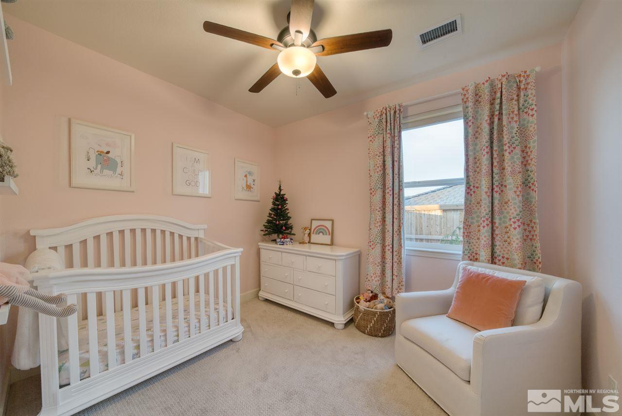 10380 Gold Mine Drive Reno, NV 89521 - Photo 17 of 23 a bedroom with furniture and a window