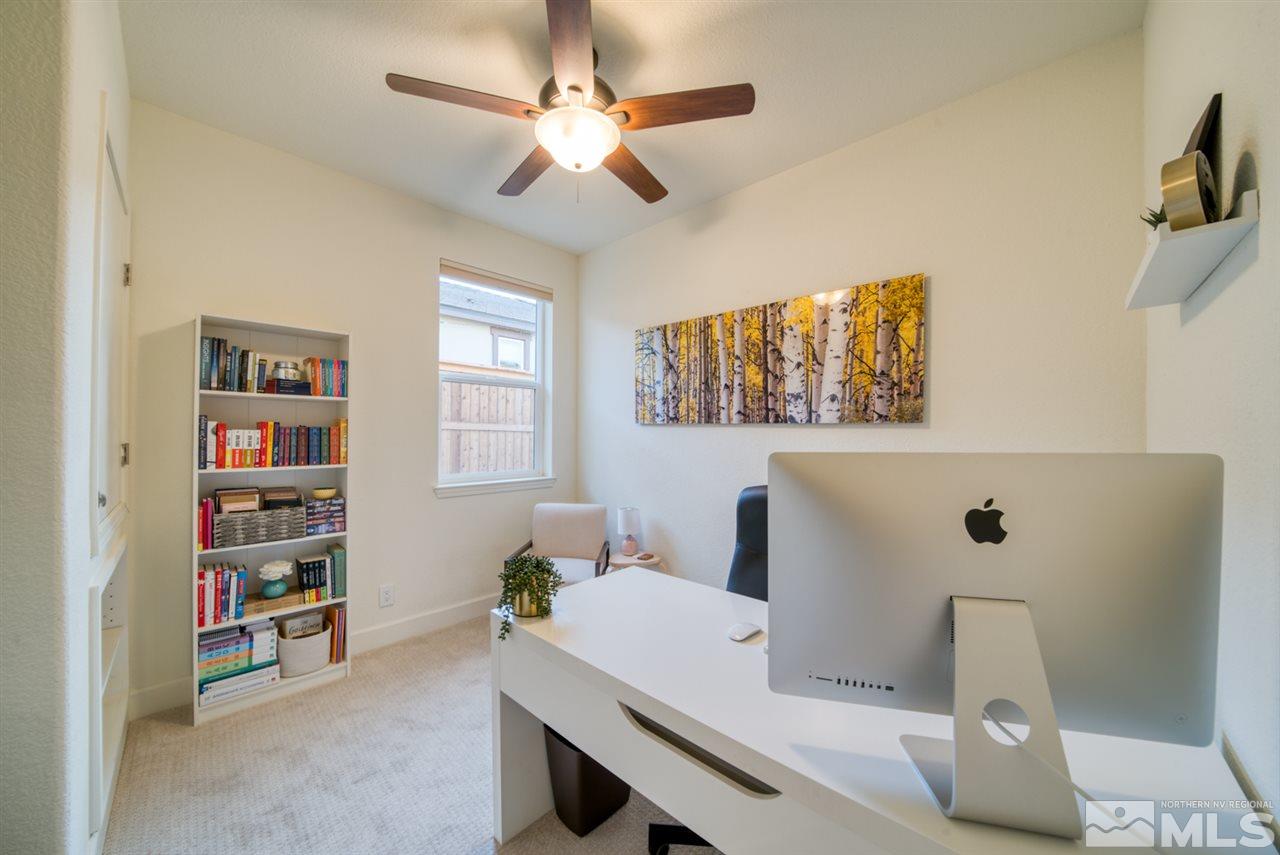 10380 Gold Mine Drive Reno, NV 89521 - Photo 20 of 23 a room with a workspace and a couch