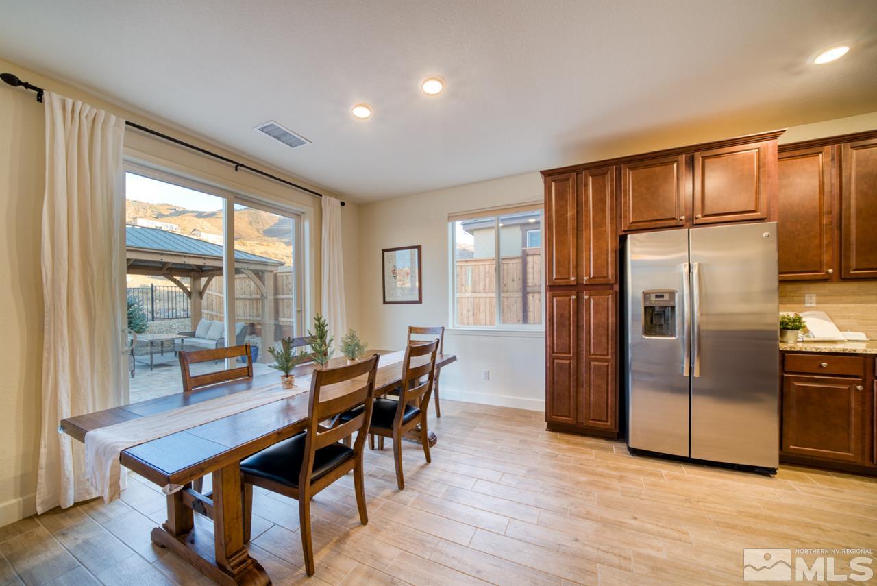 10380 Gold Mine Drive Reno, NV 89521 - Photo 10 of 23 a view of a kitchen with dining room and wooden floor