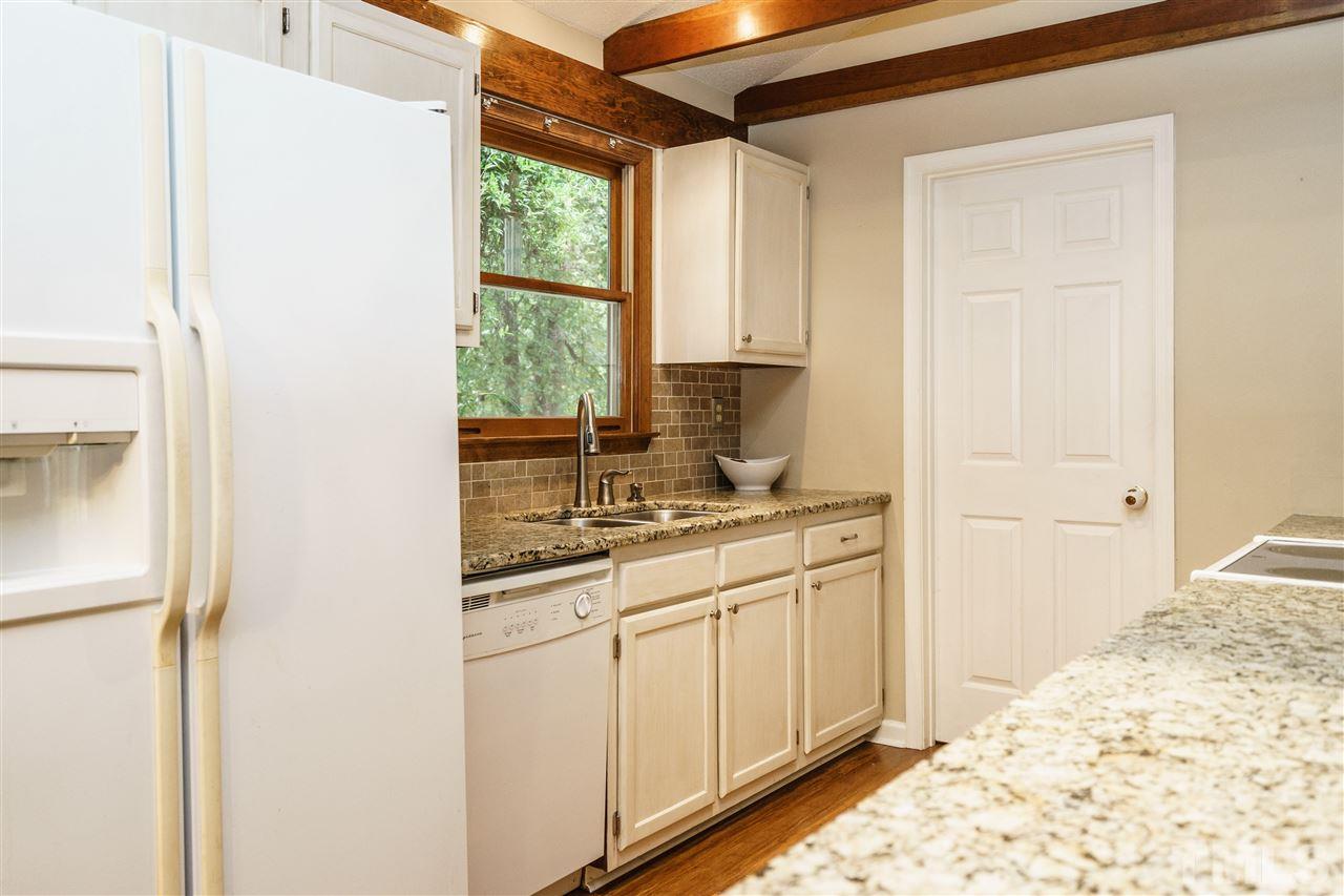 1300 Buckhorn Road Garner, NC 27529 - Photo 12 of 25 a bathroom with a sink and a window