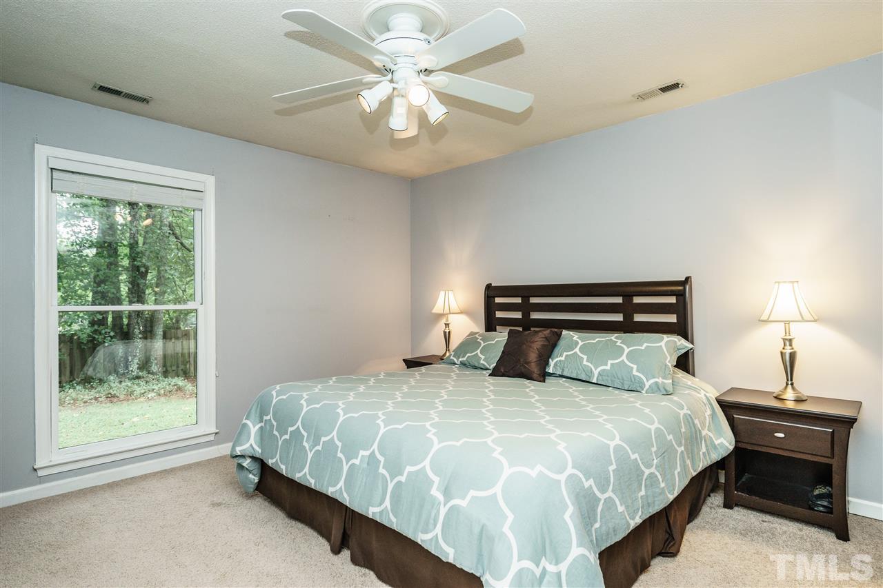 1300 Buckhorn Road Garner, NC 27529 - Photo 16 of 25 a bedroom with a bed and a window