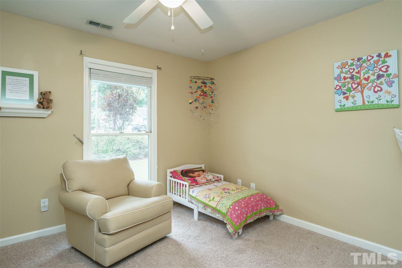 1300 Buckhorn Road Garner, NC 27529 - Photo 20 of 25 a living room with a couch and a window