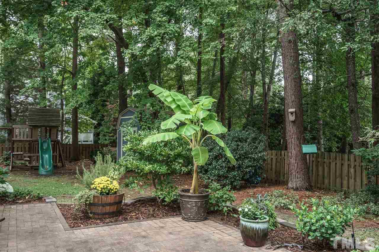 1300 Buckhorn Road Garner, NC 27529 - Photo 22 of 25 a view of a garden with plants and trees