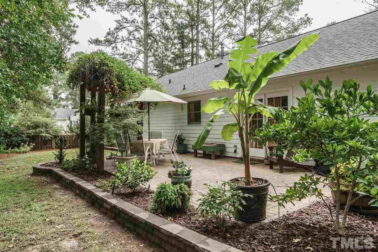 1300 Buckhorn Road Garner, NC 27529 - Photo 23 of 25 a front view of a house with garden