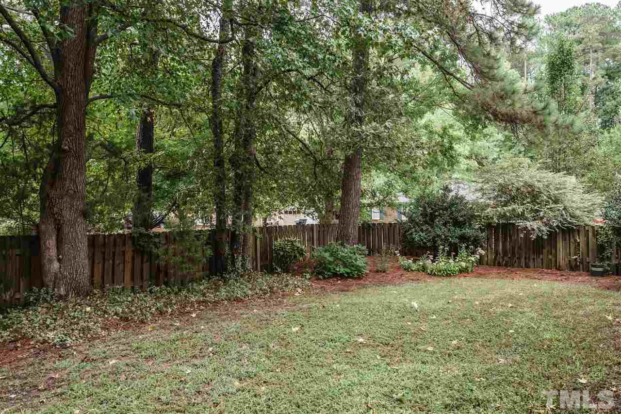 1300 Buckhorn Road Garner, NC 27529 - Photo 25 of 25 a backyard of a house with lots of green space