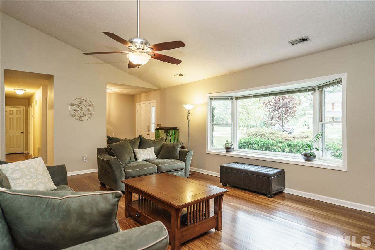 1300 Buckhorn Road Garner, NC 27529 - Photo 4 of 25 a living room with furniture and a large window