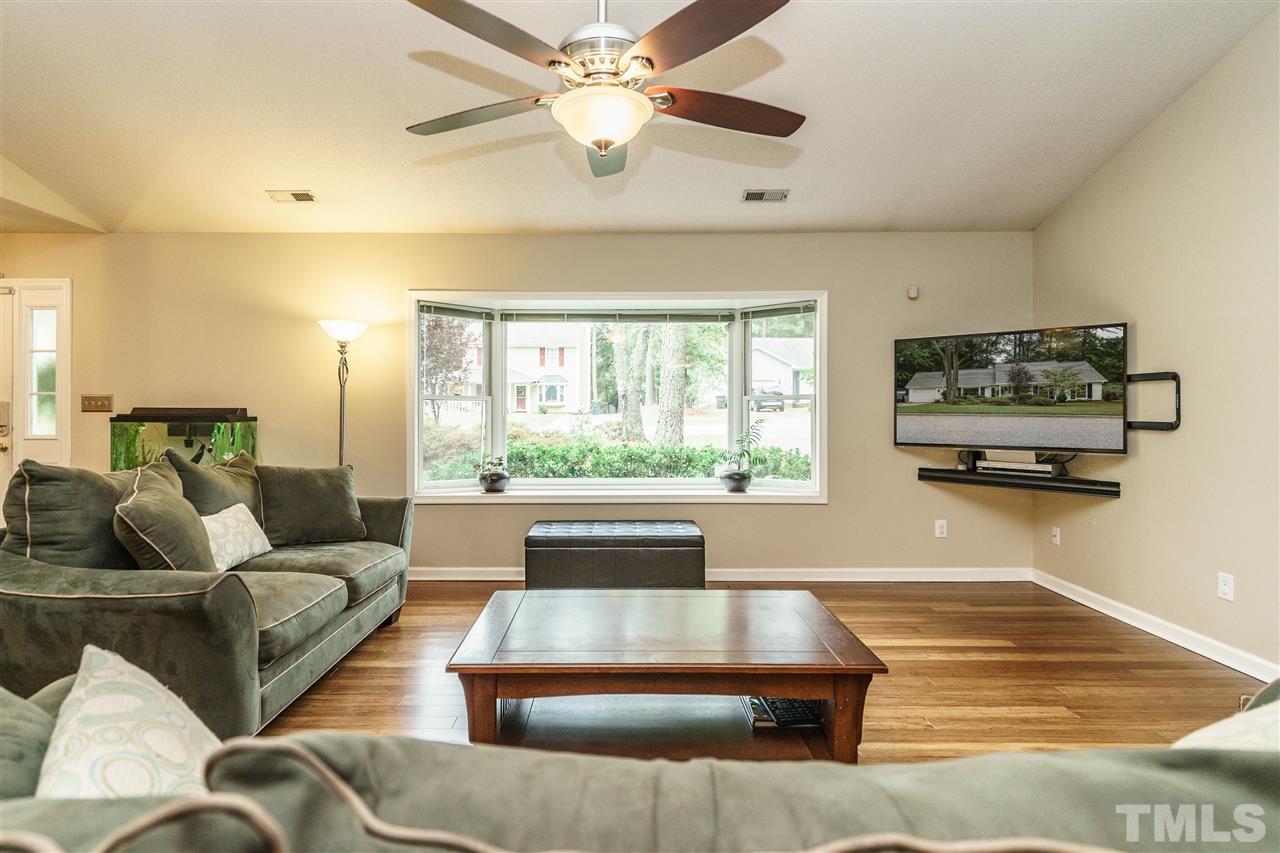 1300 Buckhorn Road Garner, NC 27529 - Photo 5 of 25 a living room with furniture and a large window