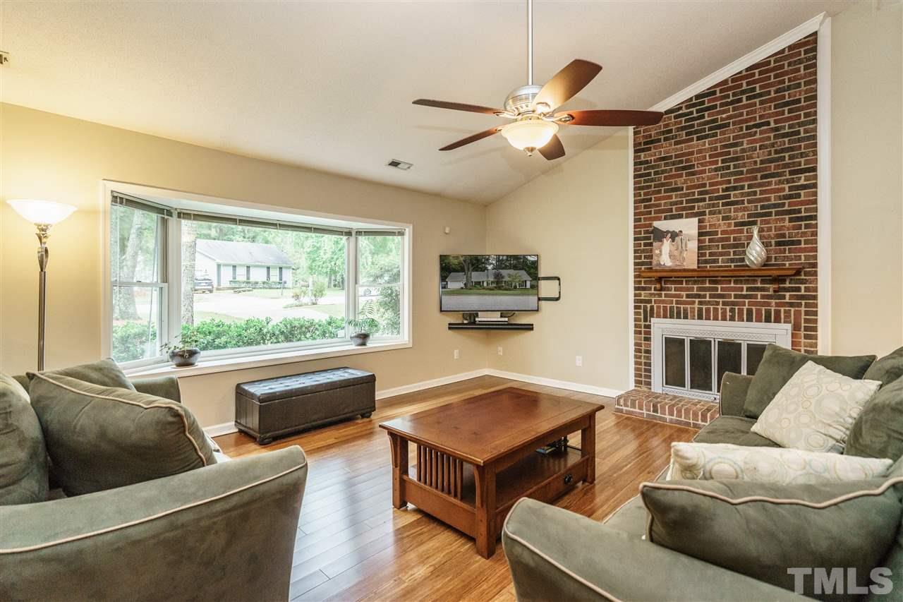 1300 Buckhorn Road Garner, NC 27529 - Photo 6 of 25 a living room with furniture and a large window
