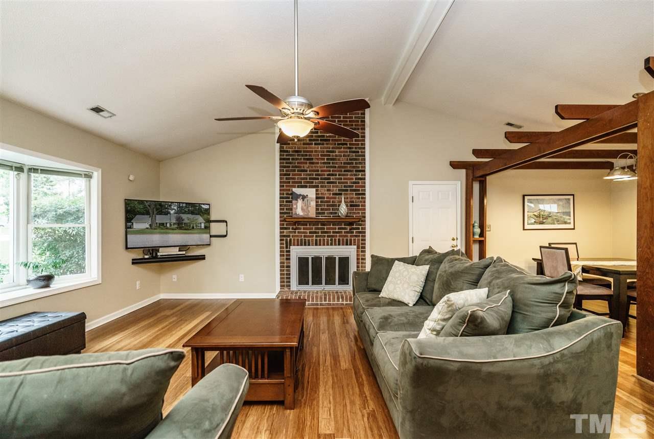 1300 Buckhorn Road Garner, NC 27529 - Photo 7 of 25 a living room with furniture and a flat screen tv