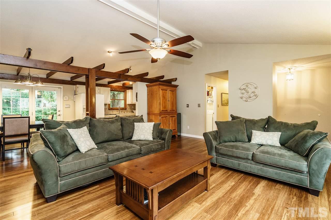 1300 Buckhorn Road Garner, NC 27529 - Photo 8 of 25 a living room with furniture and a large window