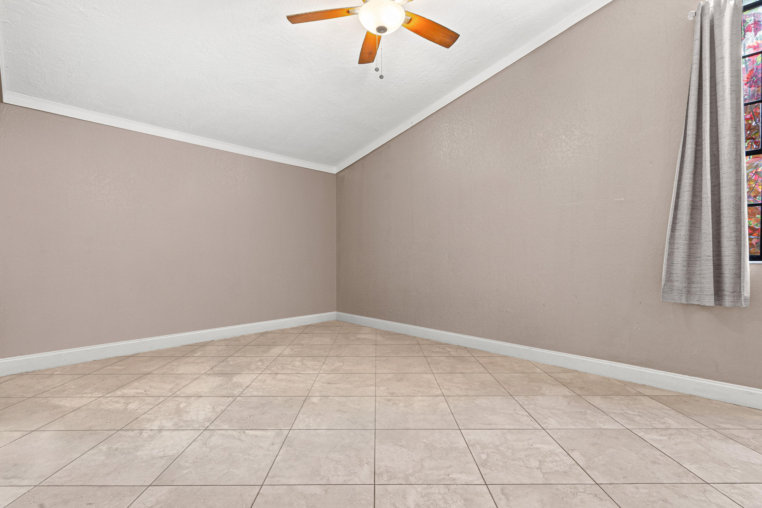 4134 Northwest 2nd Lane Delray Beach, FL 33445 - Photo 17 of 28 an empty room with a window