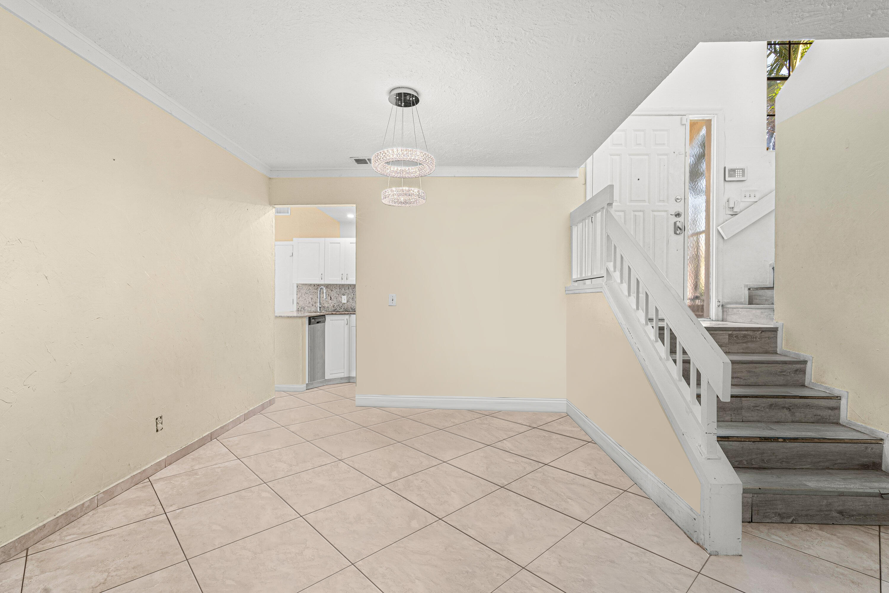 4134 Northwest 2nd Lane Delray Beach, FL 33445 - Photo 4 of 28 a view of entryway and hall with a window