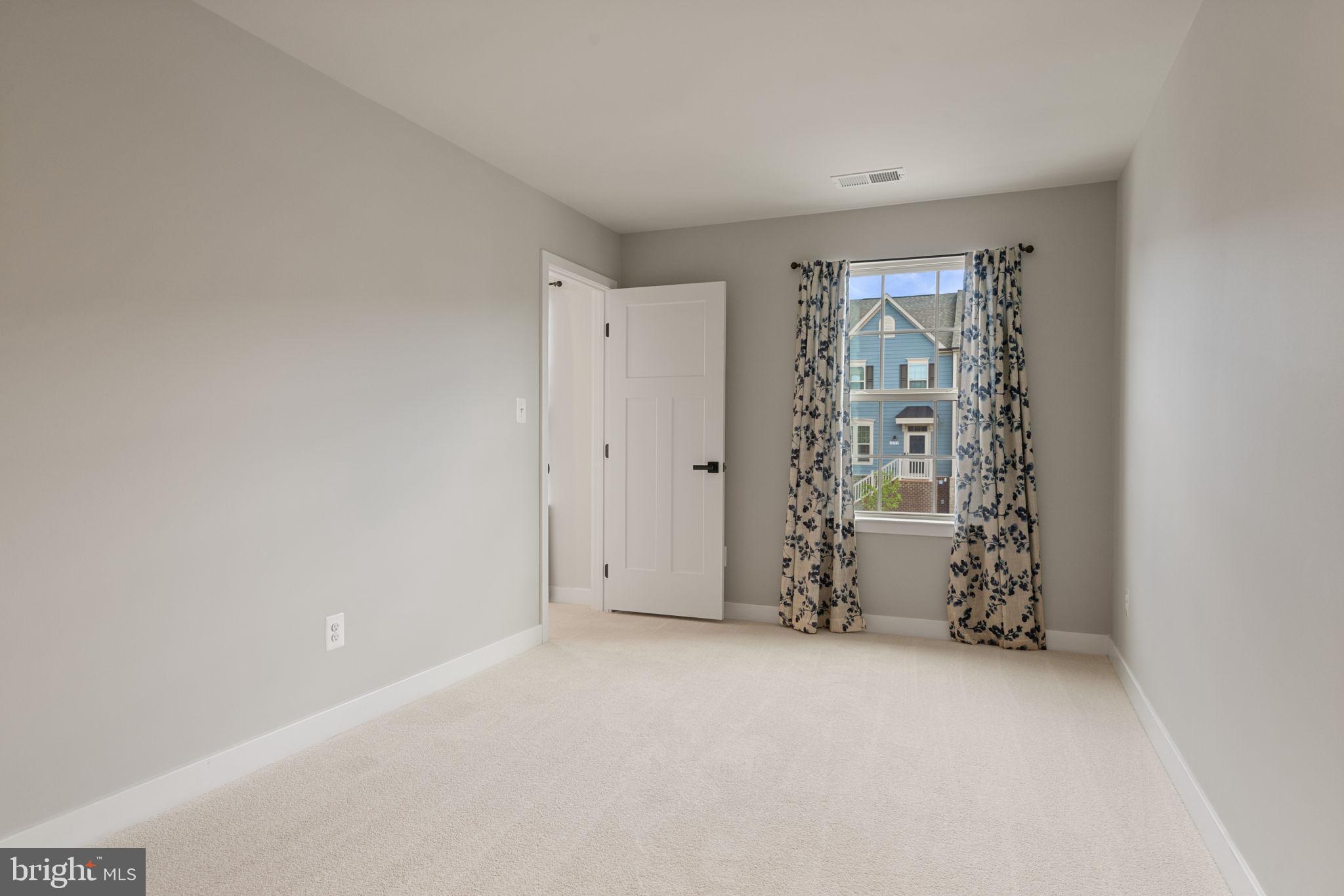 18180 Red Mulberry Road Dumfries, VA 22026 - Photo 27 of 87 a view of an empty room with a window