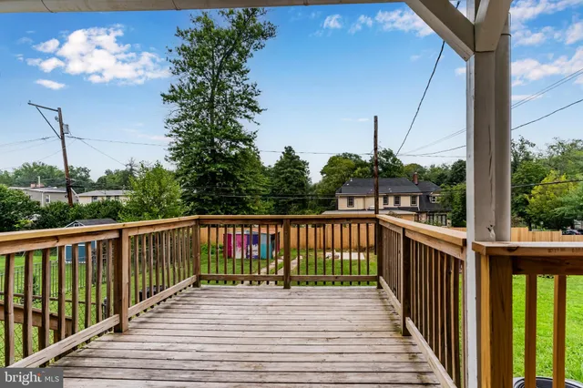 a view of a balcony with wooden floor