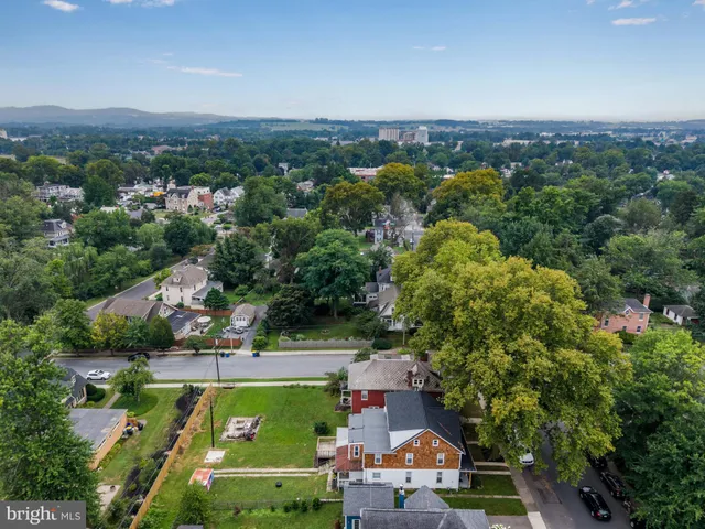 an aerial view of a house with a garden