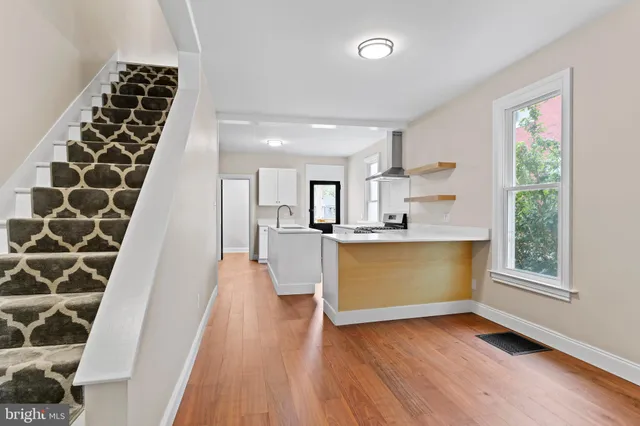 a view of kitchen with window and stainless steel appliances