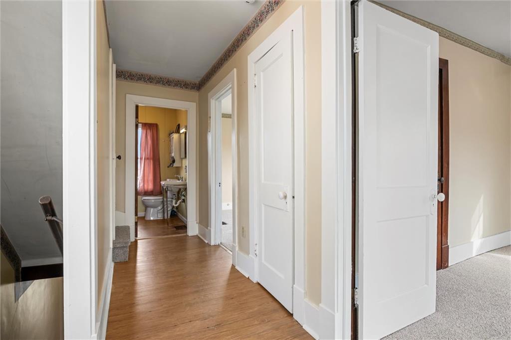 325 Walnut Street Vandergrift, PA 15690 - Photo 15 of 29 a view of a hallway with wooden floor and closet