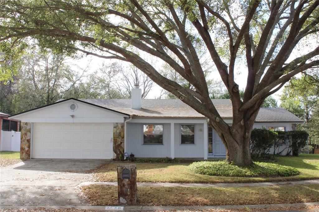 1638 Lamplighter Way Orlando, FL 32818 - Photo 1 of 25 a view of a house with a yard