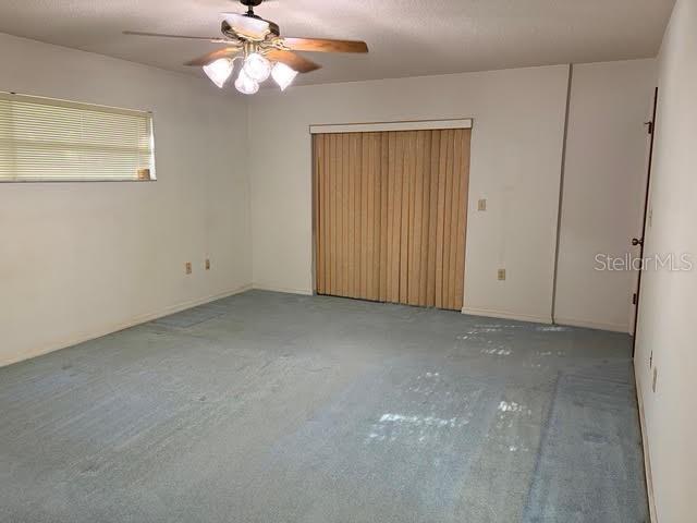 1638 Lamplighter Way Orlando, FL 32818 - Photo 12 of 25 a view of an empty room with a window