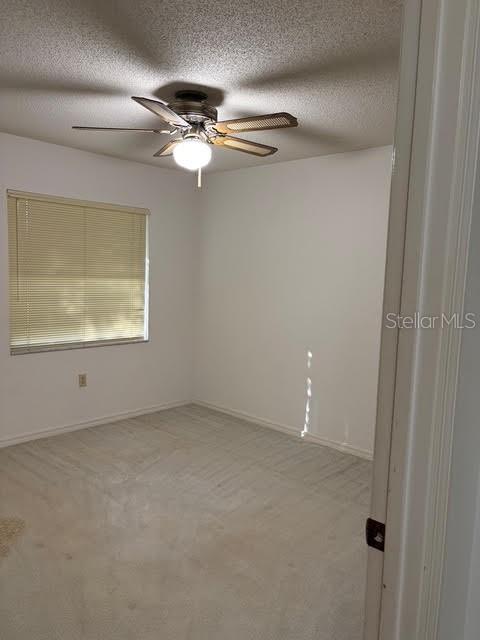 1638 Lamplighter Way Orlando, FL 32818 - Photo 19 of 25 a view of an empty room with a window