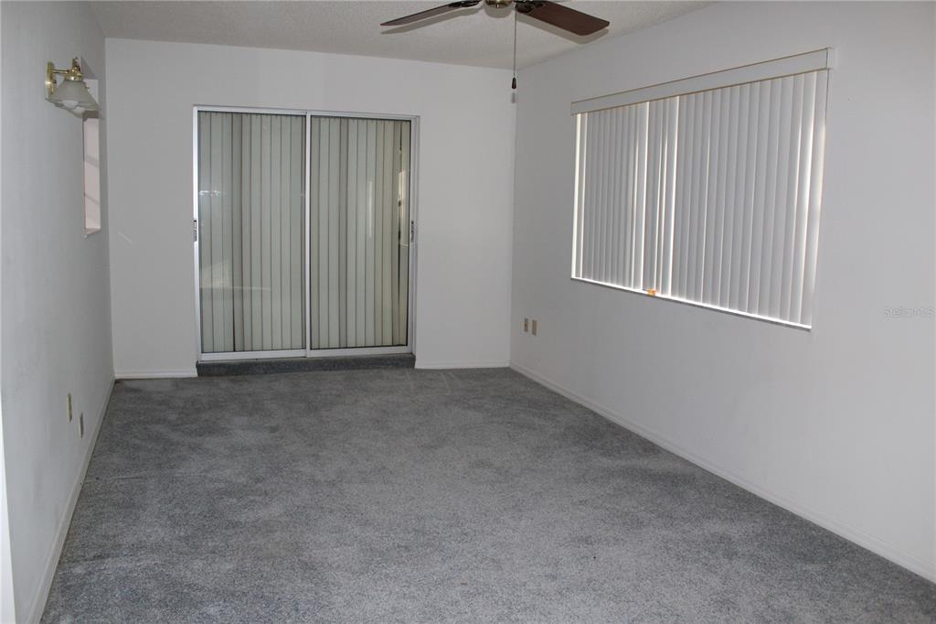 1638 Lamplighter Way Orlando, FL 32818 - Photo 22 of 25 an empty room with windows