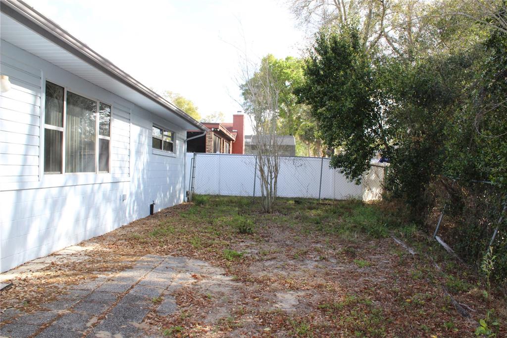 1638 Lamplighter Way Orlando, FL 32818 - Photo 25 of 25 a backyard of a house