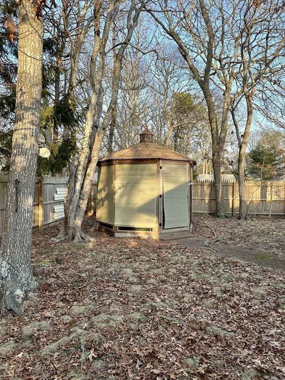 32 Shallow Brook Road Yarmouth, MA 02664 - Photo 17 of 18 a view of backyard with green space