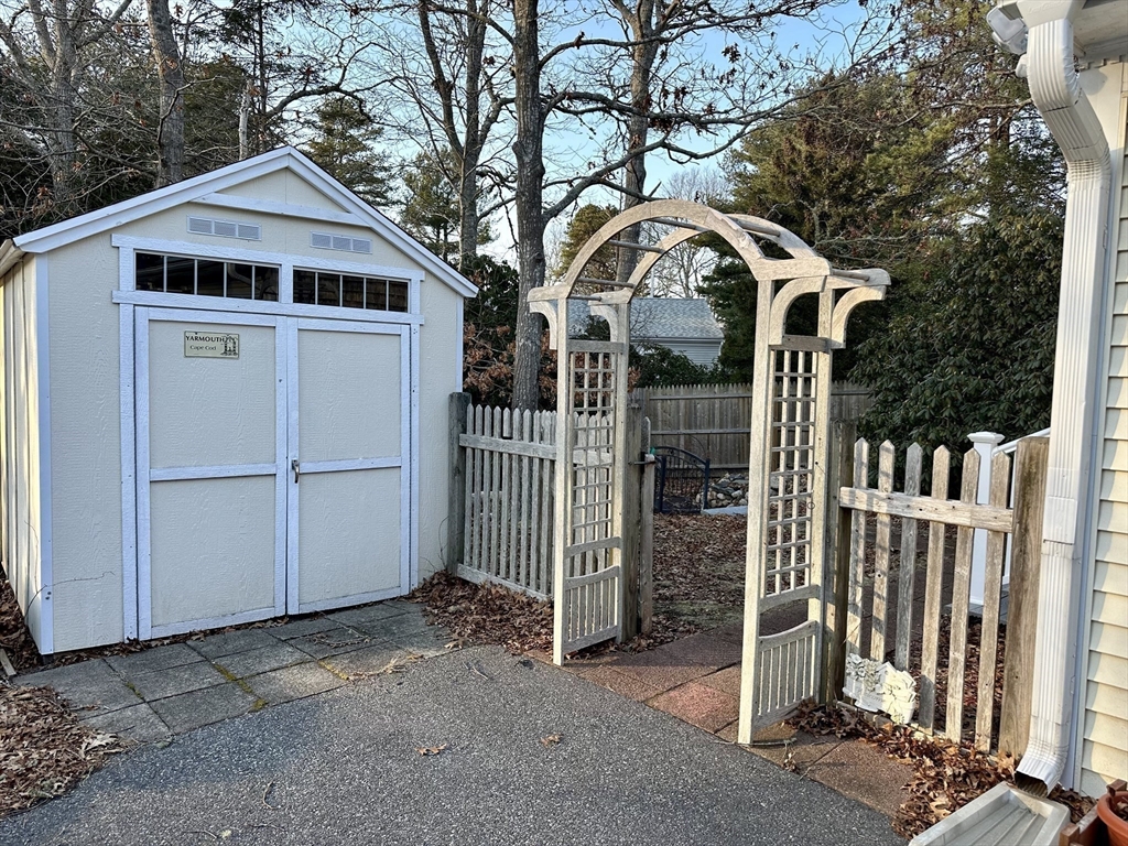 32 Shallow Brook Road Yarmouth, MA 02664 - Photo 3 of 18 a front view of a house with parking space