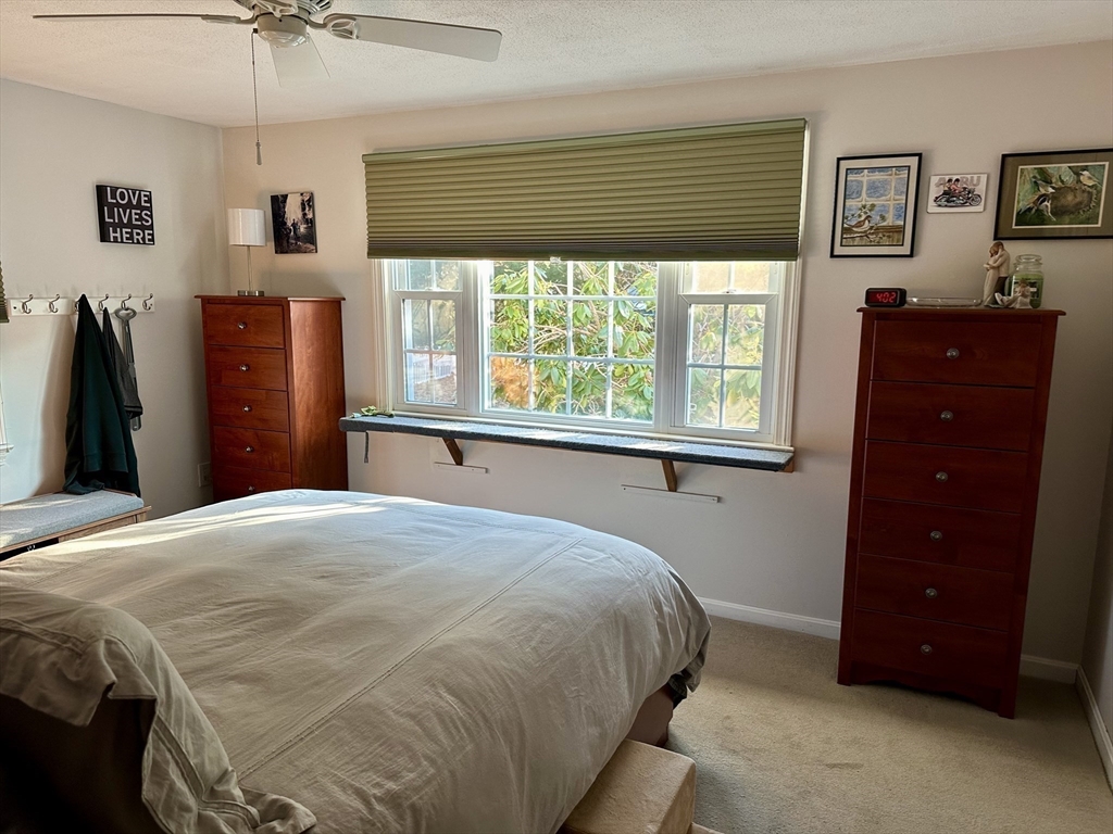 32 Shallow Brook Road Yarmouth, MA 02664 - Photo 6 of 18 a bedroom with a bed and a dresser