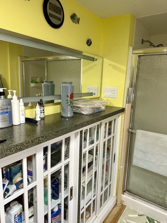 32 Shallow Brook Road Yarmouth, MA 02664 - Photo 8 of 18 a bathroom with a granite countertop sink and a mirror