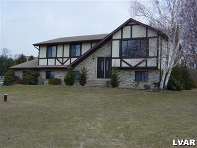 202 Ruth Road Bath, PA 18014 - Photo 1 of 10 a front view of a house with a yard