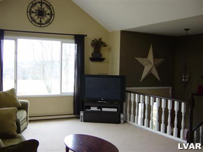 202 Ruth Road Bath, PA 18014 - Photo 3 of 10 a bedroom with furniture and a window