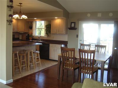 202 Ruth Road Bath, PA 18014 - Photo 5 of 10 a kitchen with stainless steel appliances granite countertop a dining table chairs and granite counter tops