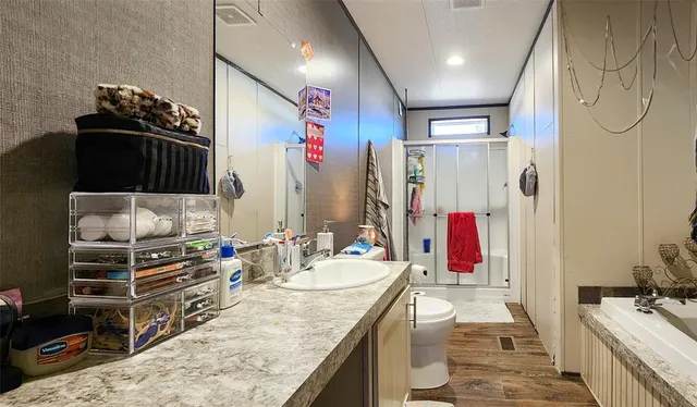 a kitchen with stainless steel appliances kitchen island granite countertop a refrigerator and a stove