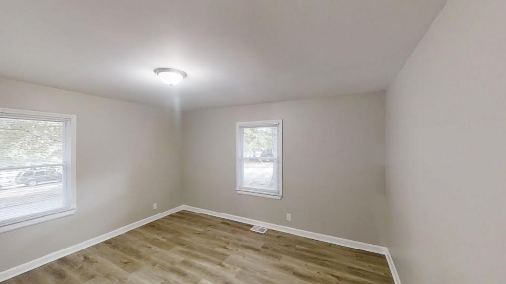 568 McWilliams Road Southeast Atlanta, GA 30315 - Photo 14 of 17 an empty room with a window