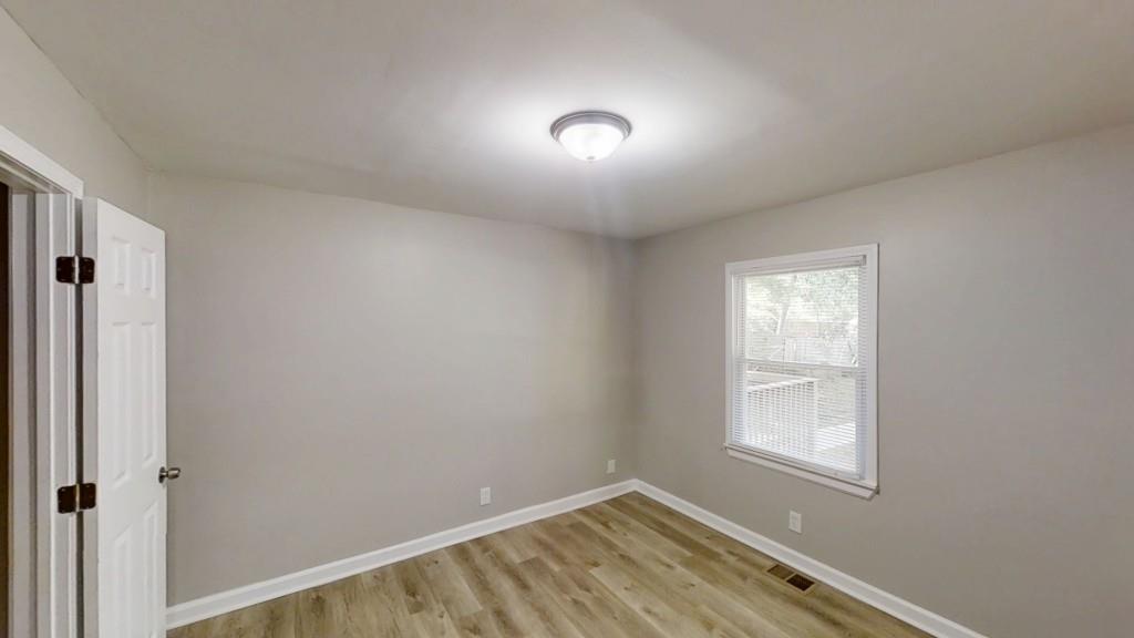 568 McWilliams Road Southeast Atlanta, GA 30315 - Photo 7 of 17 a view of room with window and closet area