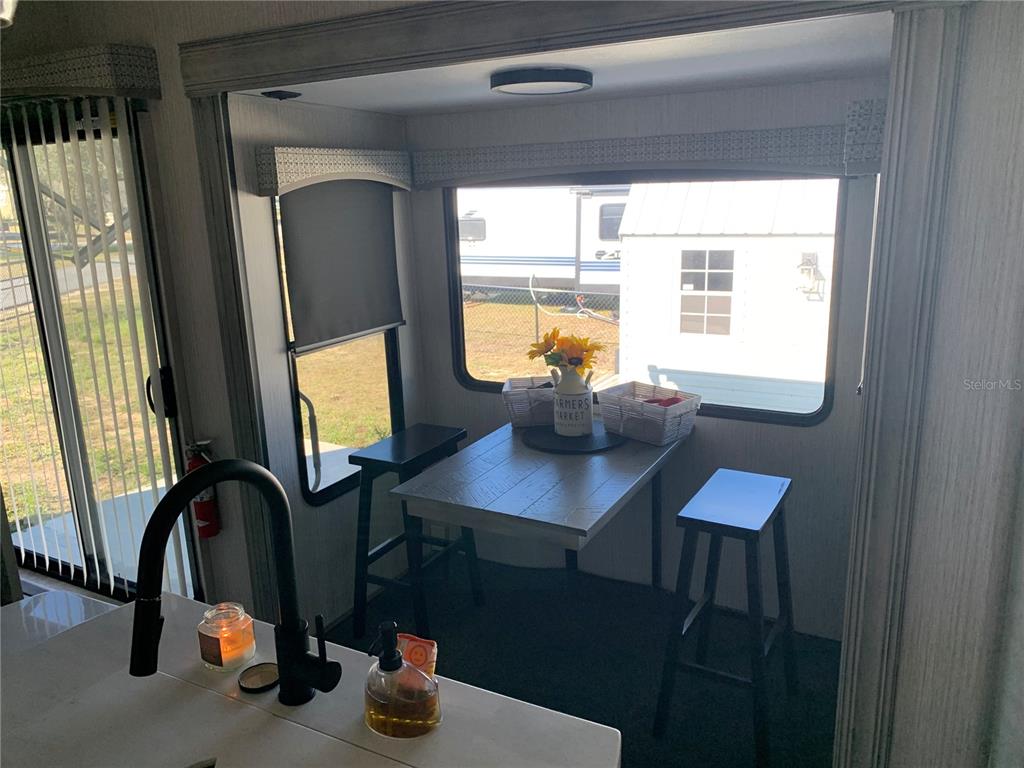 15991 Northeast 243rd Place Road, Unit 143 Fort McCoy, FL 32134 - Photo 15 of 35 a view of a workspace with a window